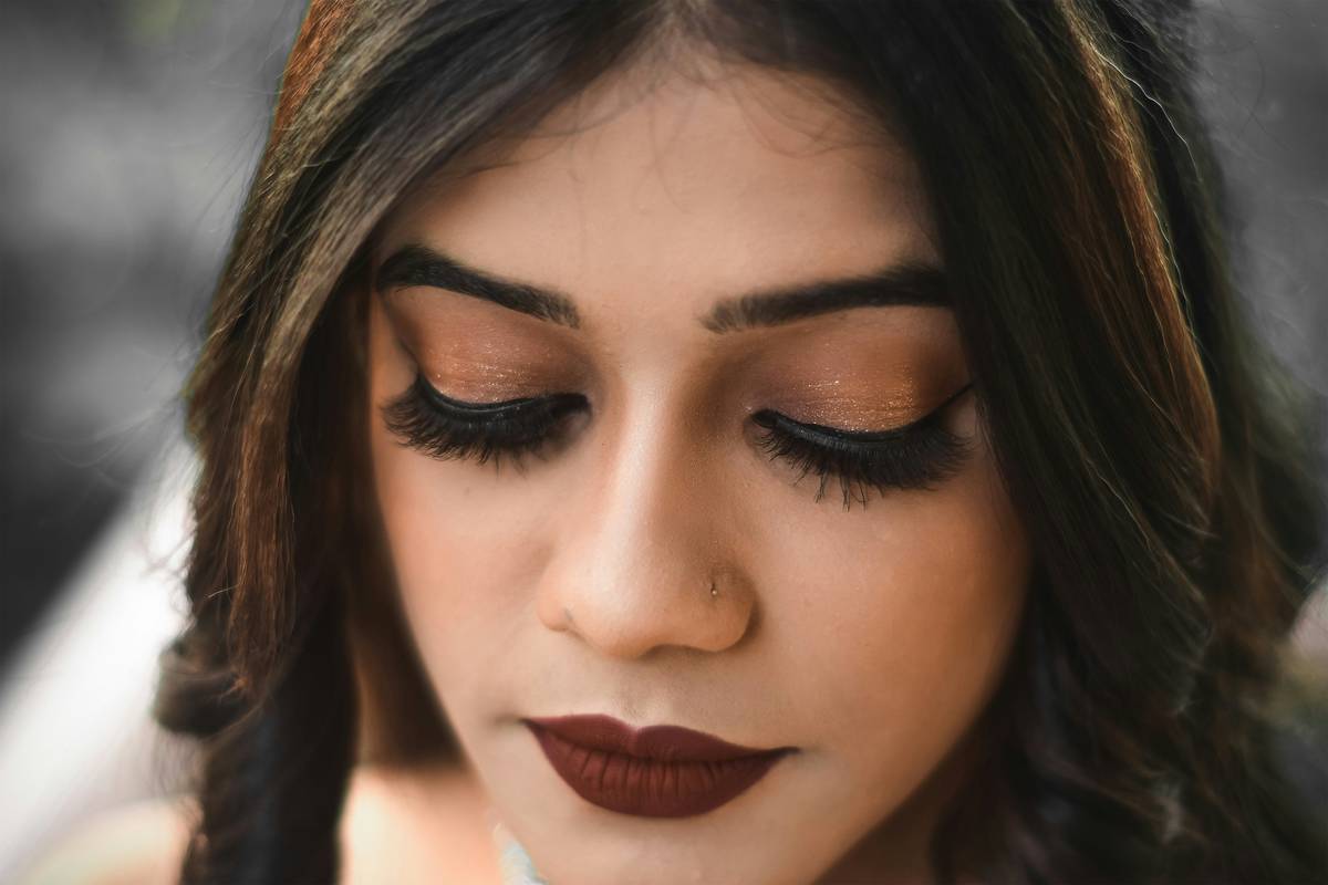 Model demonstrating premium contour application with angled brush on cheekbones